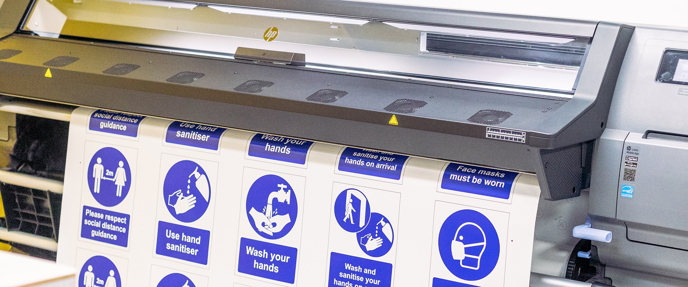 A photo of safety signage being printed